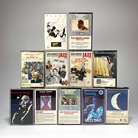 Front-facing view of 11 vintage jazz cassette tapes arranged in two rows showing cover art.