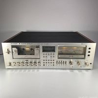 Front view of the Sharp RT-3388 stereo cassette deck showing cassette slot, controls, and VU meters.