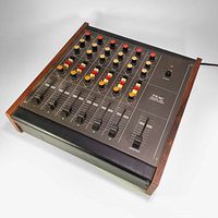 Top angle view of the vintage TEAC Model 2A 6-channel mixer showing control knobs, sliders, and power switch.