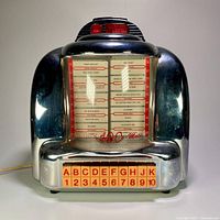 Front view of the vintage Thomas 100 Select-o-Matic jukebox style radio and cassette deck showing song selection panel and letter/number buttons.