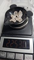 A small quantity of six natural rough Morganite crystals placed on a digital scale reading 22.53 carats total weight.