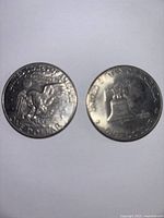 Photo of reverse sides of two coins showing eagle and Liberty Bell designs.