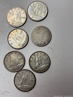 Obverse side of Canadian dimes showing the sailboat design and visible dates 1936, 1939, and 1956
