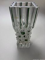 Full view of the MCM Swedish crystal vase showing geometric and circular cut-out design.