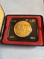 Close-up of the coin's obverse side showing mounted RCMP officer with date and inscriptions.