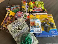 Mixed boys toys including Bakugan, Rescue Heroes, Minions, Monster Truck, and army crawlers figures
