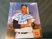 Signed color photograph of Johnny Blanchard in New York Yankees uniform with bat and personalized inscription in blue ink.