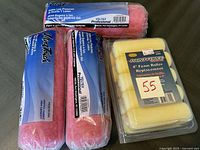 Paint roller covers and foam rollers shown from top angle, displaying packaging and brand information.