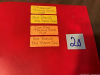 Sticky notes on red binder label Spider-Man Trading Cards 1-63 and Behind the Scenes Cards; Iron Man Trading Cards 1-63 and Behind the Scenes Cards