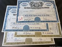 Four vintage stock certificates from The Great Atlantic & Pacific Tea Company, showing company seals, dated stamps and signatures.