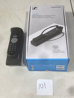 Philips Samsung USB Phone positioned standing on base with original Sennheiser box nearby