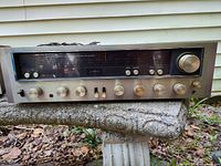 Front view of vintage Kenwood KR-6060 AM FM stereo receiver showing tuning display, control knobs, and switches.