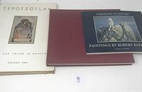 Three art-related books stacked together, showing front covers of 'Tepotzotlan and Color in Mexico' and 'Portraits of Nature: Paintings by Robert Bateman,' and the maroon hardcover book beneath.