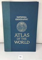 Front cover of National Geographic 5th Edition Atlas of the World. Shows title, publisher emblem, and condition of the cover.