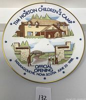 Front of the commemorative plate showing the Tim Horton Children's Camp illustration and event details.