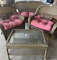 Set overview showing loveseat, two chairs with cushions, and coffee table with glass top