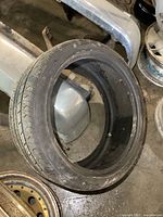 Single used Fusion 225/40R18 tire standing upright, showing sidewall condition and markings.