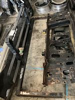 Steel Back Rack black painted steel frame with 'BACK RACK' branding, showing the full rack and extension bars with visible rust and wear.