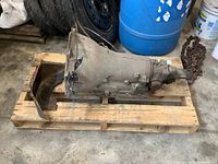 Side view of transmission assembly on wooden pallet