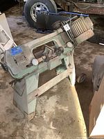 Right-side view of the band saw on its stand, showing overall size and condition