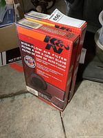 Two boxes of K&N high flow air filters stacked vertically showing brand, product type, and packaging.
