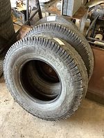 Two Hercules Terra Trac AT truck tires stacked vertically, showing tread and sidewall.