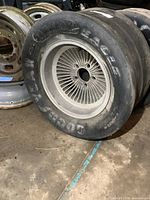 Full side view of the Goodyear Eagle tire mounted on the multi-spoke 15" wheel, showing tire wear and branding.