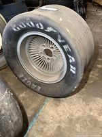 Side view of Goodyear Eagle racing tire showing width, branding, and overall wear.