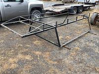 Front perspective view showing tubular steel frame and mesh front panel