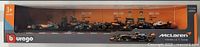 Front view of the boxed six-car set showing all McLaren race cars in the package.