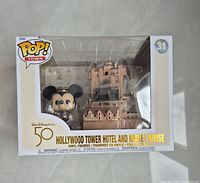 Front view of unopened Funko Pop! Town box showing Hollywood Tower Hotel and Mickey Mouse figures with 50th Anniversary Walt Disney World branding.