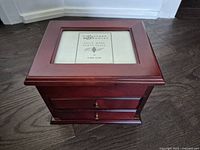 Solid wood photo jewelry box with two drawers and photo frame on top showing placeholder card labelled "The Classic Models Solid Wood Photo Boxes by Casa Elite"