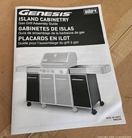 Instruction manual showing assembly guide for Weber Genesis Island Cabinetry gas grill