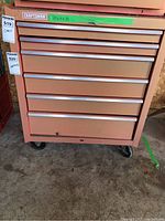 Front full view of Craftsman tool chest showing all 6 drawers and wheels, with visible wear on metal finish.