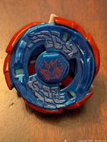 Top view showing blue and red plastic energy ring with phoenix emblem.