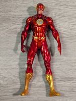 Front view of the Flash action figure, showing detailed musculature and emblem