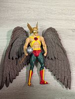 Front view of Hawkman action figure showing detailed costume, wings, helmet, and mace accessory.