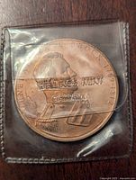 Front side of the Franklin Mint bronze medal showing General Isaac Brock profile and inscriptions.