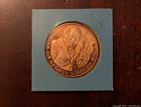 Front side of bronze coin showing Sir George Simpson portrait and inscription