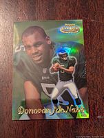 Front of 1999 Topps Donovan McNabb rookie card with holographic foil and player images
