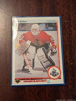 Front side of the Ed Belfour rookie hockey card showing image and stats.