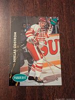 Front of rookie hockey card featuring Nicklas Lidstrom in Detroit Red Wings uniform, showing player name, Rookie tag, and Parkhurst branding.