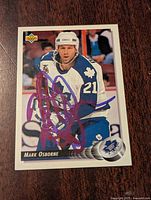 Front of 1992-93 Upper Deck Mark Osborne hockey card showing Maple Leafs uniform and blue autograph signature across the player image.
