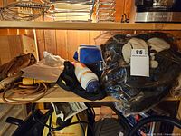 Photo of various sports items including gloves, jump rope, water bottle and ski masks packaged in plastic.