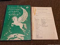 Green cover of the stamp album with title and Pegasus design.