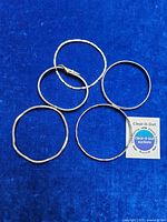 Five bangles displayed on blue background