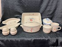 Front view of entire nine-piece ceramic serveware set
