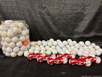 overall view of jar, loose balls, and sealed Wilson packs