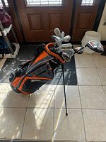 Stand bag filled with clubs, legs deployed