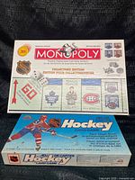Overall view of NHL Monopoly board atop NHL Hockey Card Game box
